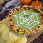 Halloween 7 Layer Dip, Halloween spider 7 layer dip, 7 layer dip Halloween style, 7 layer Mexican dip Halloween, Halloween spider web 7 layer dip, Halloween taco dip, spider web taco dip, Halloween party dips, how to make 7 layer dip