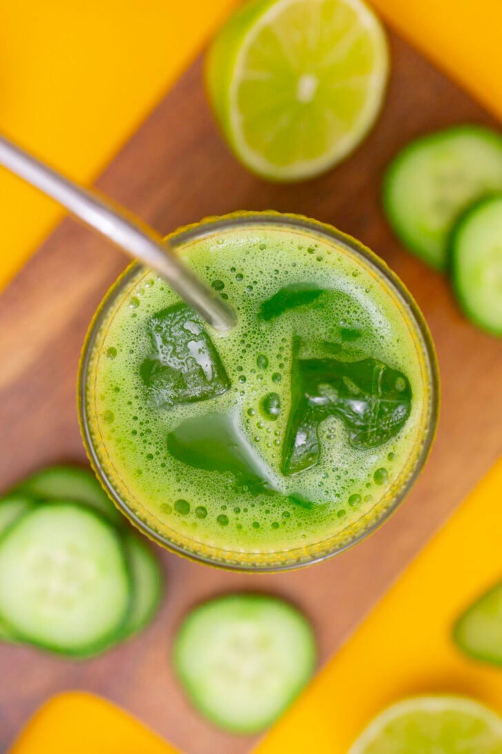 An overhead photo of a glass of cucumber agua fresca.