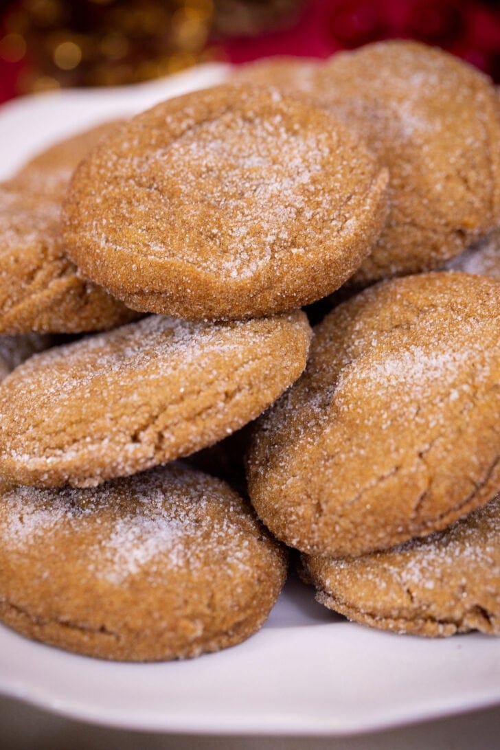 A close-up of the crackled, sugar-coated tops of soft gingerbread cookies.