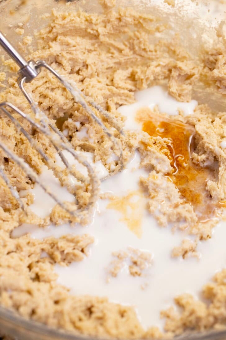Milk and vanilla extract added to the creamed butter and sugar mixture with a hand mixer.
